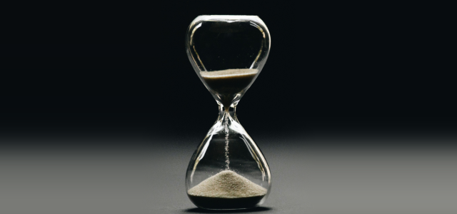 An hourglass with its sand running out